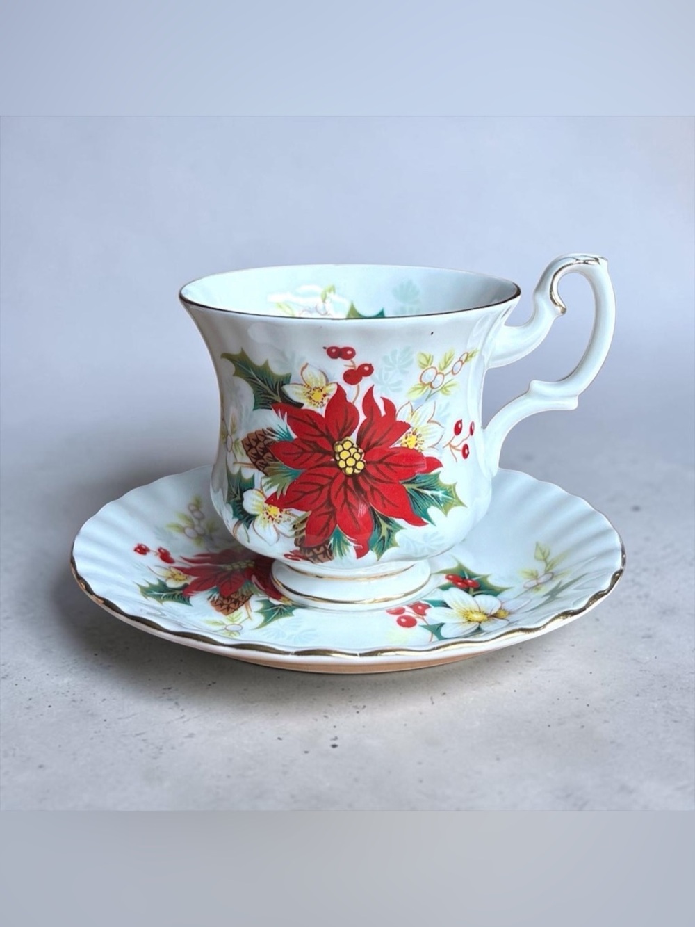 Royal Albert Yuletide Poinsettia Teacup and Saucer in Red, Green, Gold